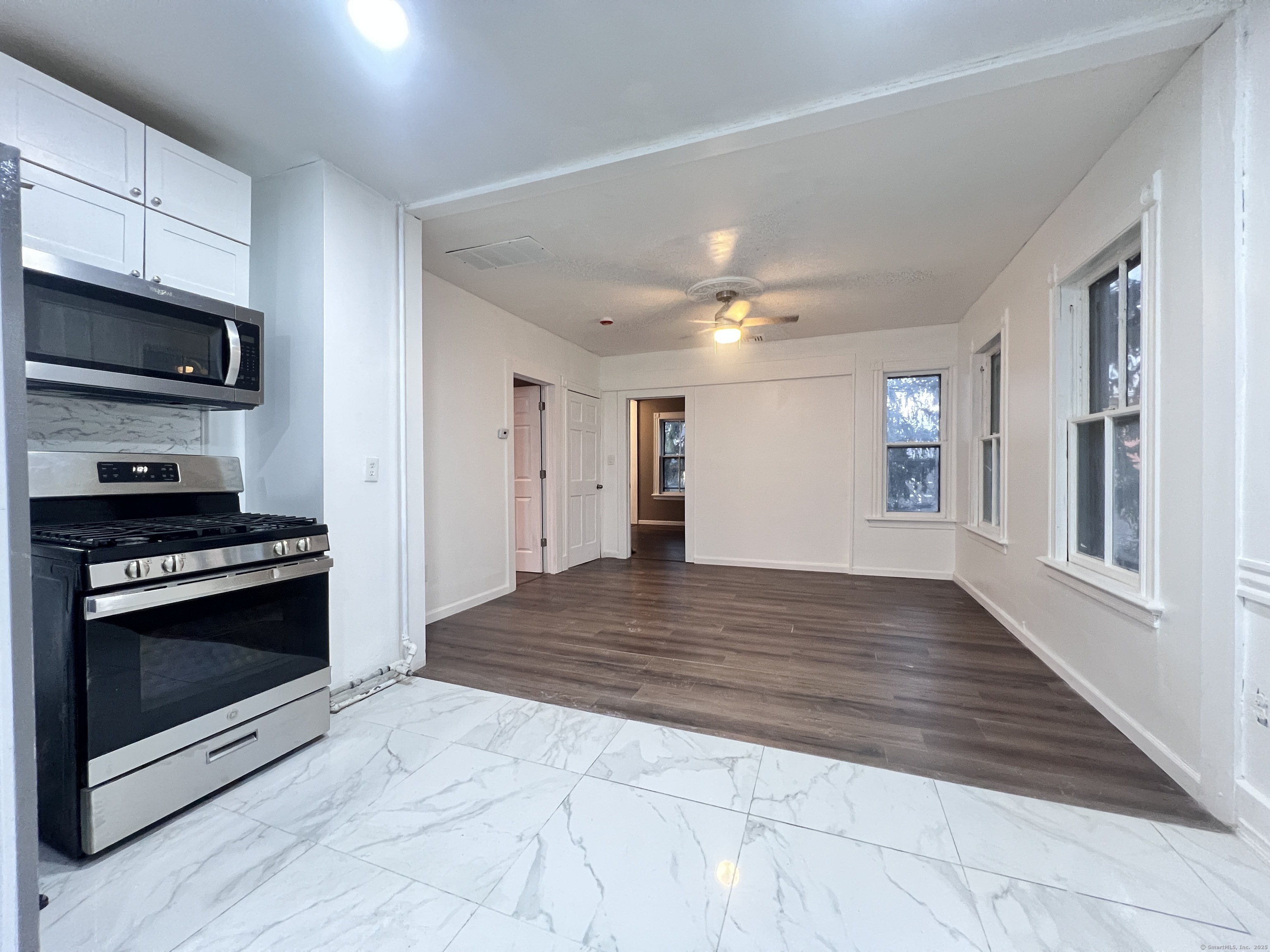 40 Exchange Street, Unit 2 New Haven, CT 06513 - Photo 4 of 12 a view of kitchen stove microwave and cabinets
