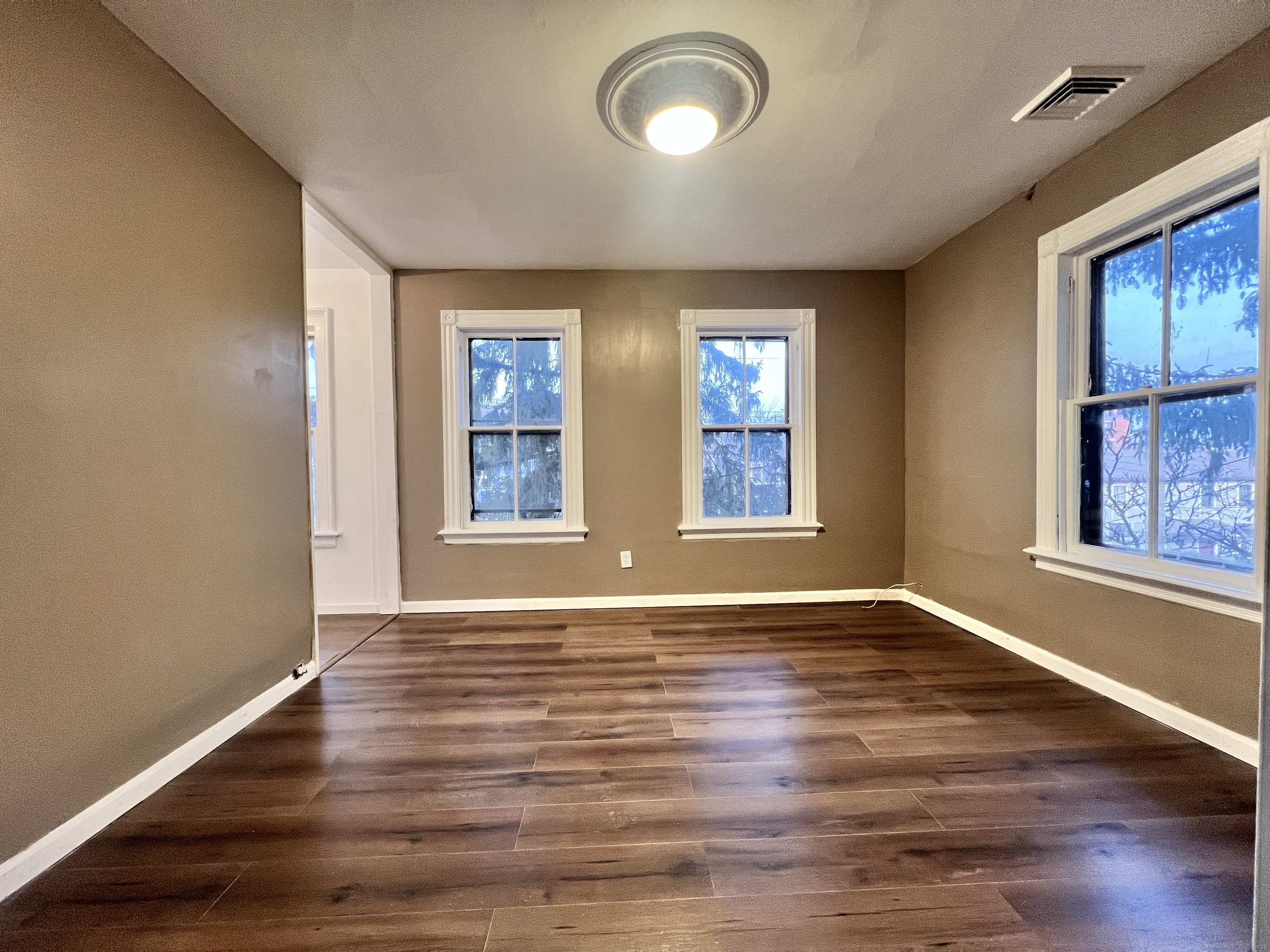 40 Exchange Street, Unit 2 New Haven, CT 06513 - Photo 6 of 12 a view of an empty room with wooden floor and a window