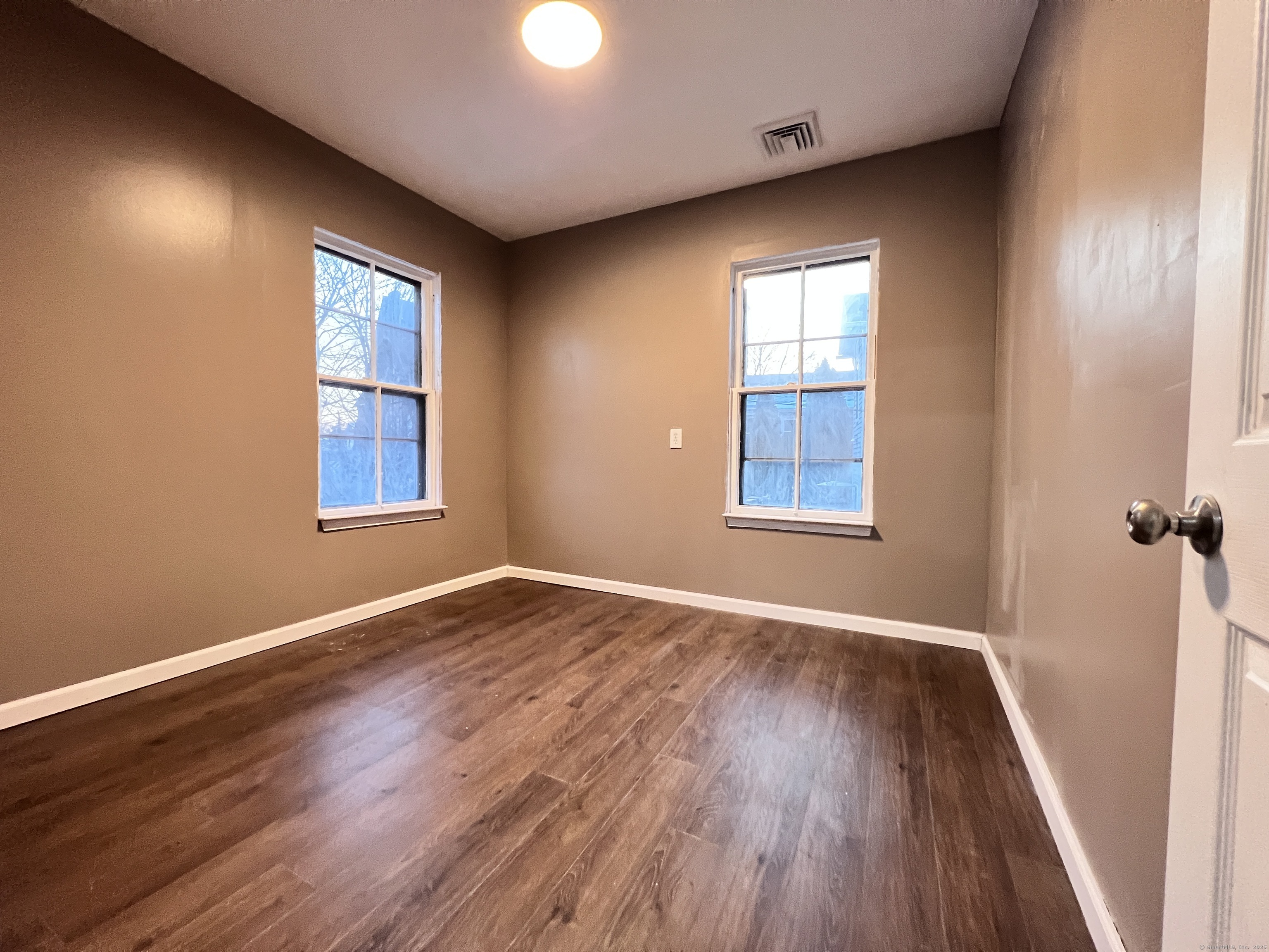 40 Exchange Street, Unit 2 New Haven, CT 06513 - Photo 9 of 12 a view of an empty room with wooden floor and a window