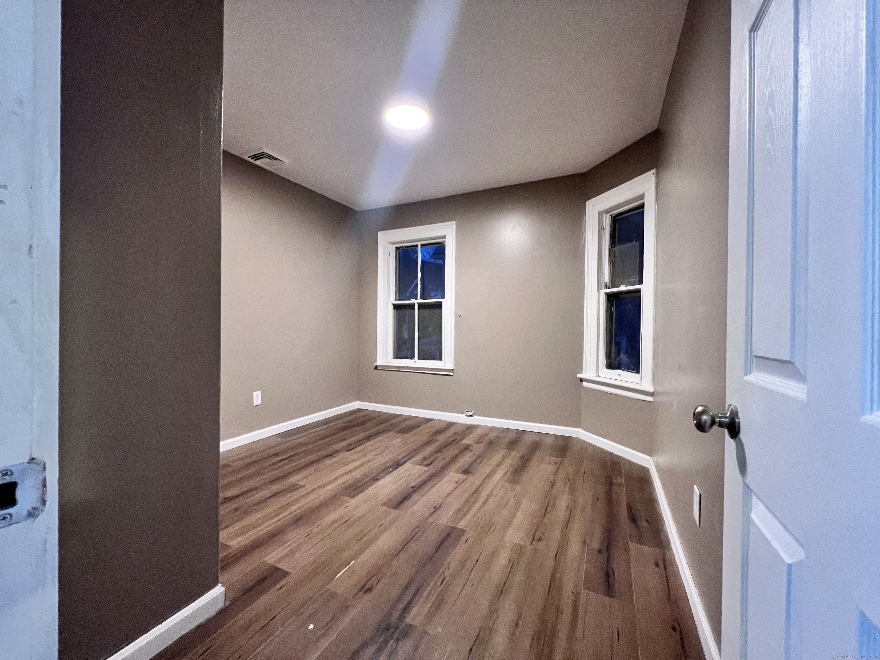 40 Exchange Street, Unit 2 New Haven, CT 06513 - Photo 10 of 12 a view of a livingroom with wooden floor and a window
