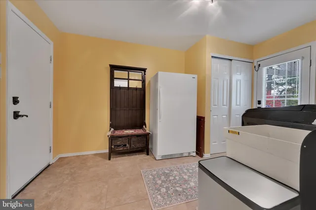 a room with furniture and a large window