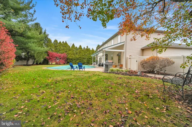 a living room with patio furniture and garden