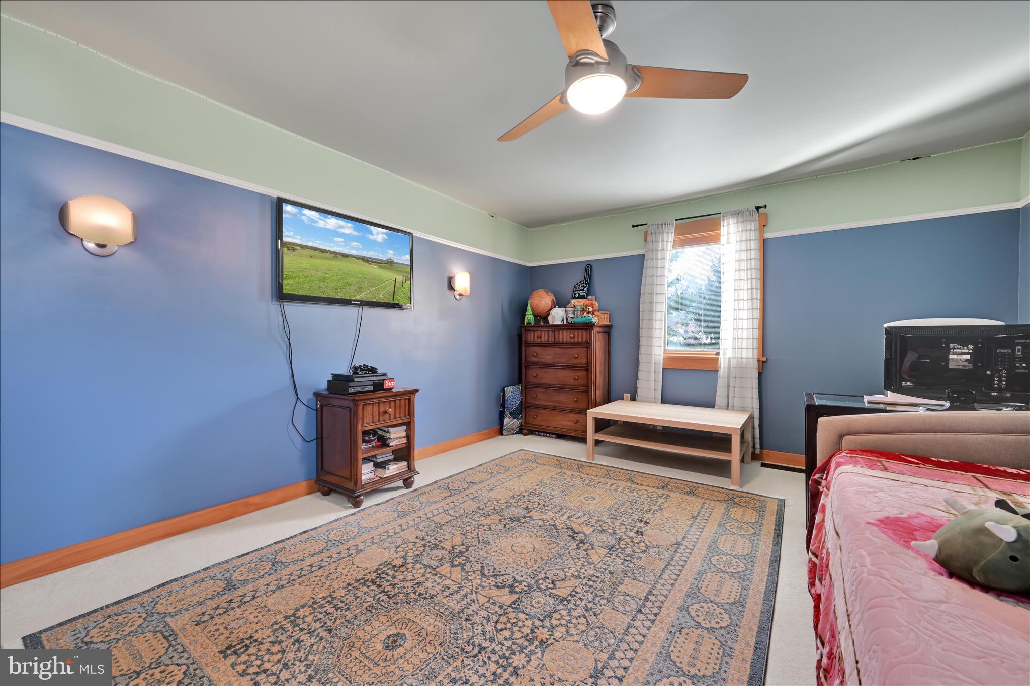 1118 Jarvis Lane Lansdale, PA 19446 - Photo 36 of 45 a bedroom with a bed and a chandelier