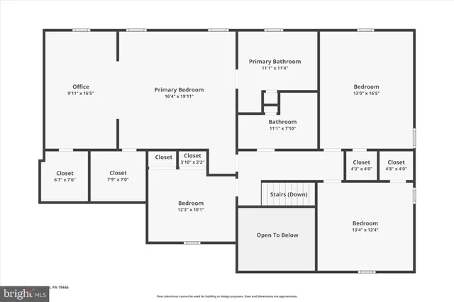 a front view of house with yard and trees in the background