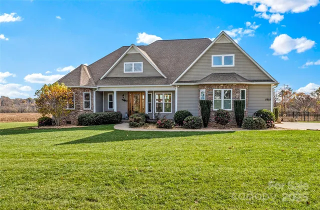 a front view of a house with swimming pool having outdoor seating