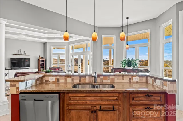 a kitchen with granite countertop a sink and a counter top space