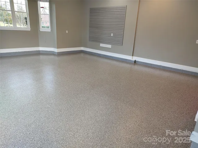 a view of an empty room with windows