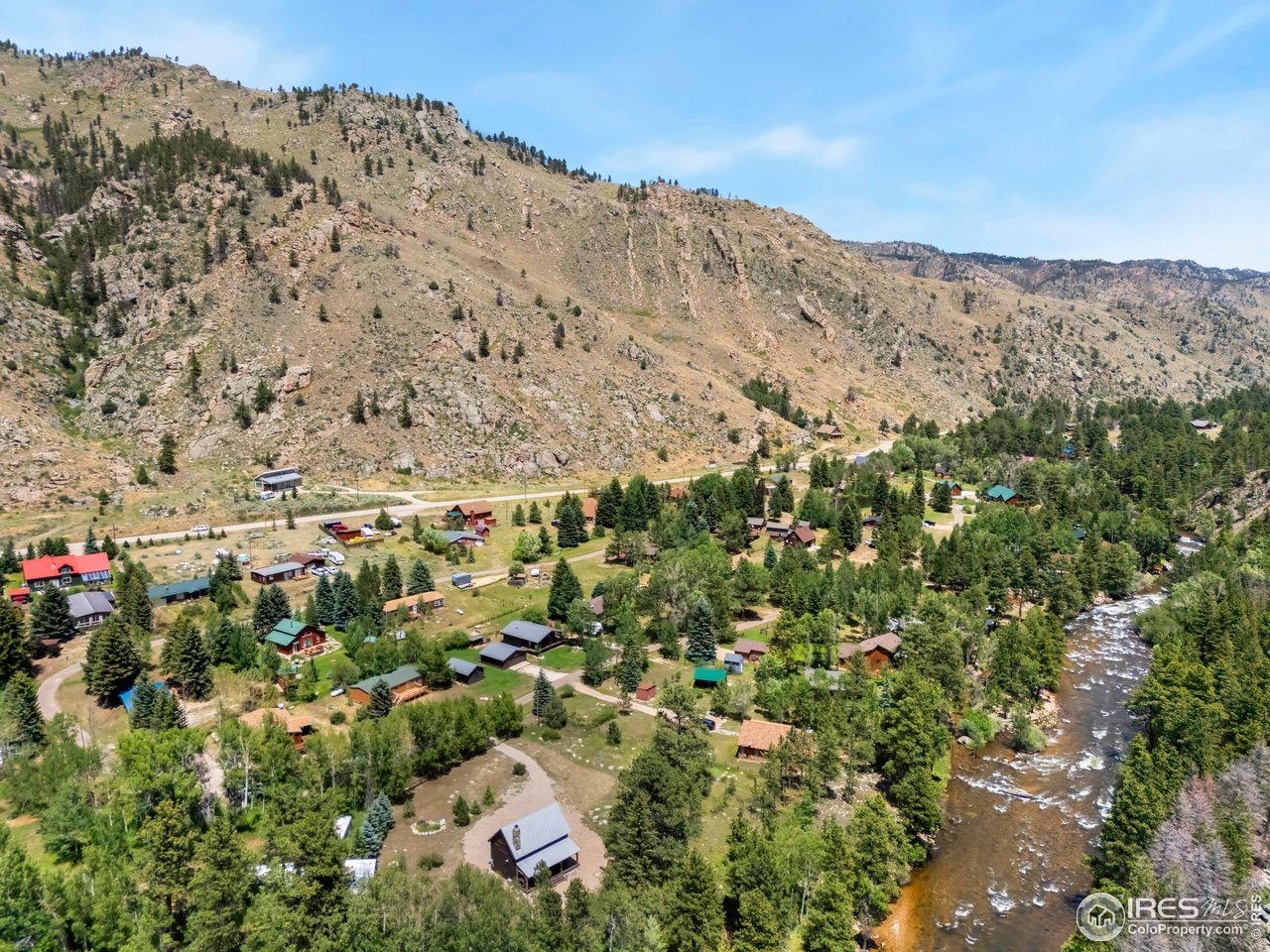 277 Riverside Drive Bellvue, CO 80512 - Photo 21 of 23 a view of a building with mountains in the background