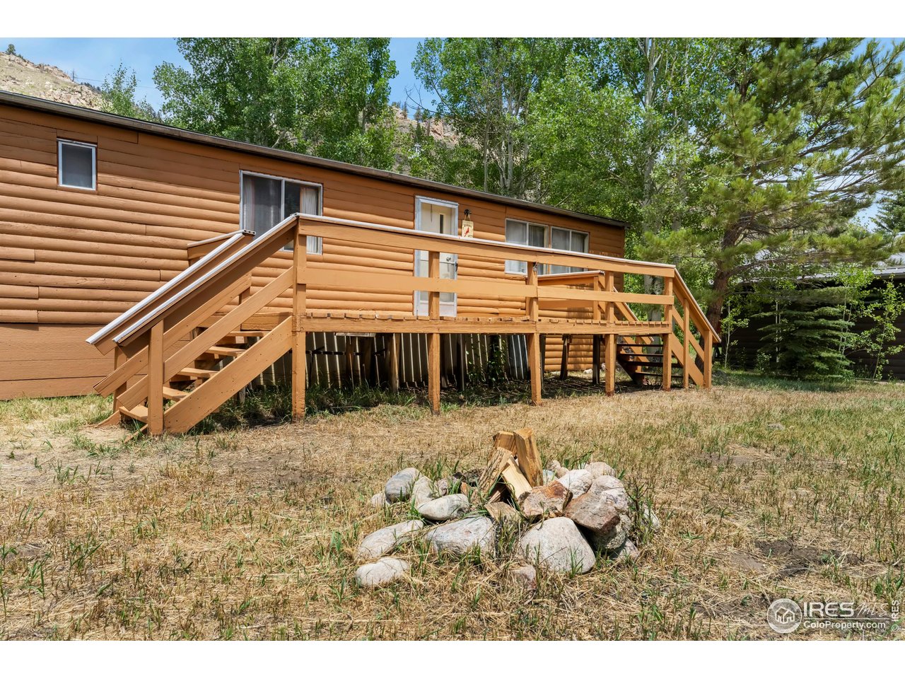 277 Riverside Drive Bellvue, CO 80512 - Photo 4 of 23 a view of a house with a yard