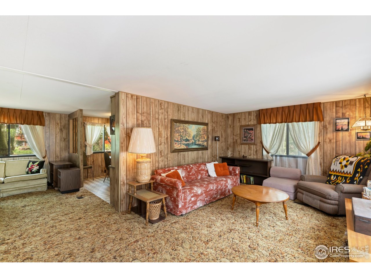 277 Riverside Drive Bellvue, CO 80512 - Photo 8 of 23 a living room with furniture and a window
