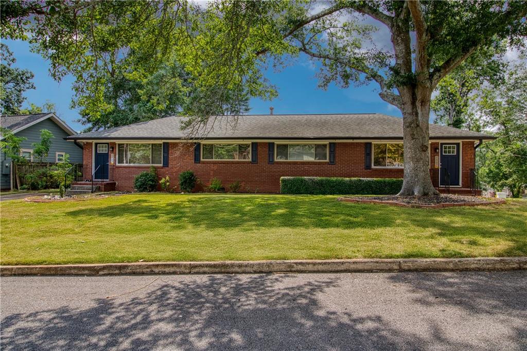 3447 Pierce Street Atlanta, GA 30337 - Photo 1 of 28 a front view of a house with a yard
