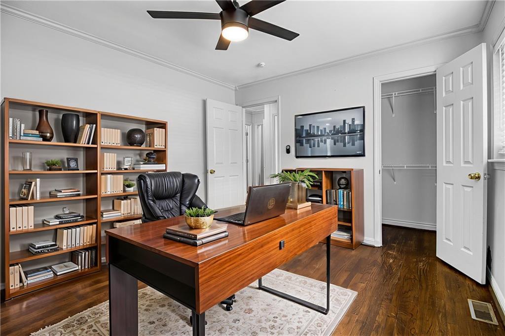 3447 Pierce Street Atlanta, GA 30337 - Photo 12 of 28 a living room with furniture and a bookshelf