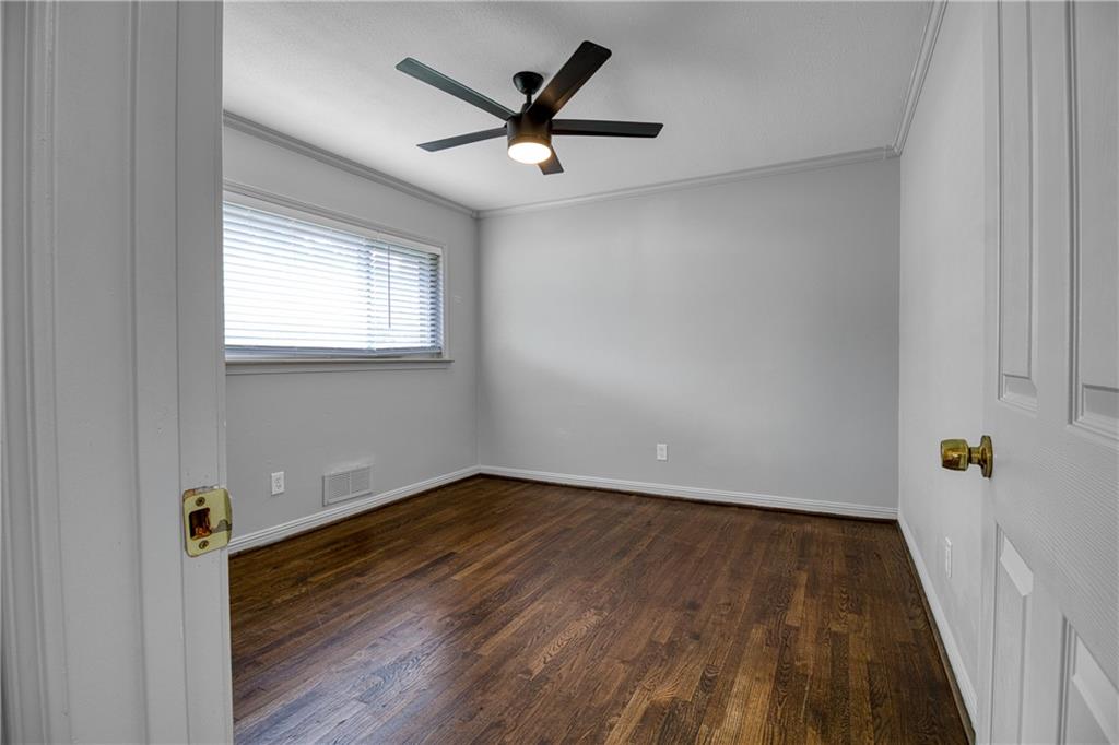 3447 Pierce Street Atlanta, GA 30337 - Photo 16 of 28 wooden floor in an empty room with a window