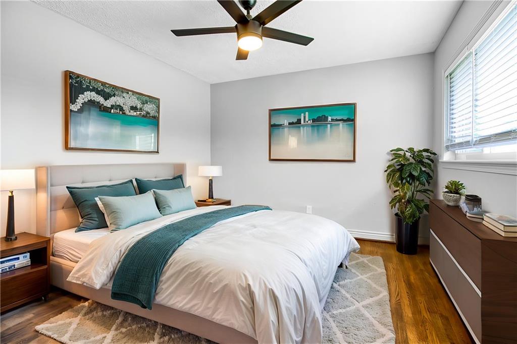 3447 Pierce Street Atlanta, GA 30337 - Photo 20 of 28 a bedroom with a bed and a potted plant