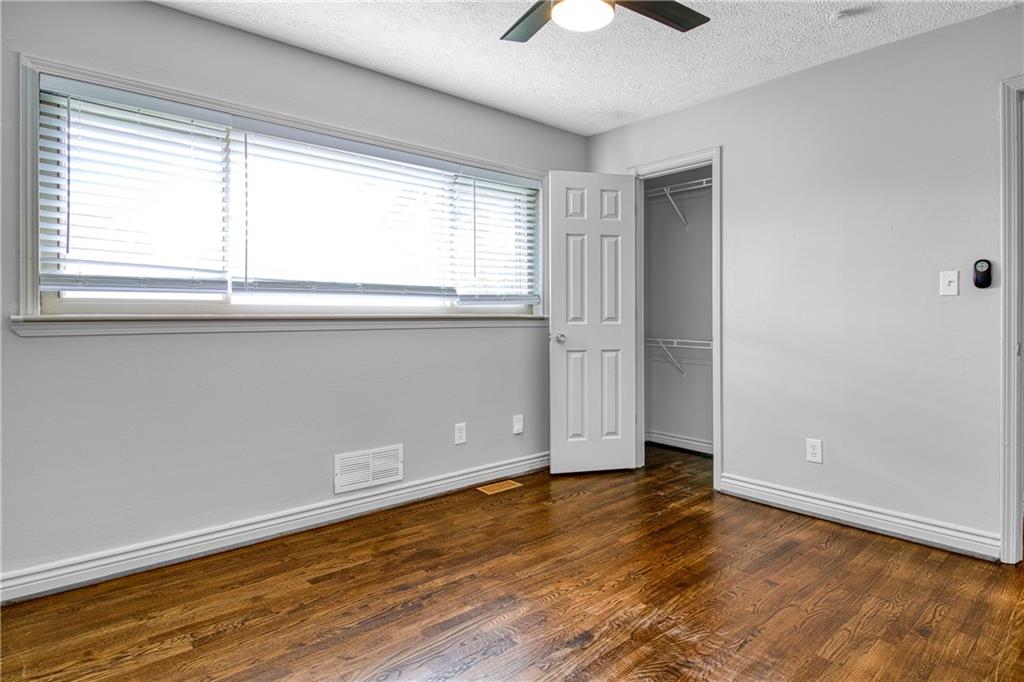 3447 Pierce Street Atlanta, GA 30337 - Photo 22 of 28 a view of an empty room with wooden floor and a window