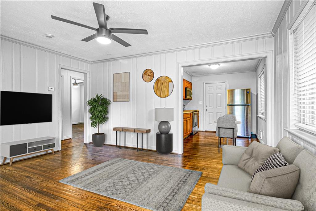 3447 Pierce Street Atlanta, GA 30337 - Photo 4 of 28 a living room with fireplace furniture and a flat screen tv