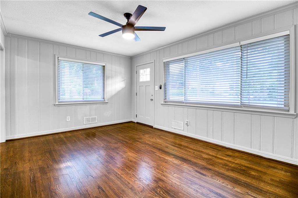 3447 Pierce Street Atlanta, GA 30337 - Photo 8 of 28 a view of an empty room with wooden floor and a window