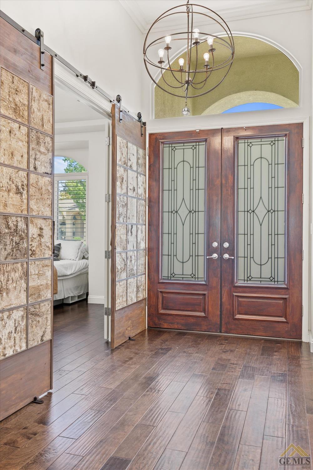 Undisclosed Address Bakersfield, CA 93311 - Photo 11 of 45 a view of livingroom with furniture wooden floor and windows