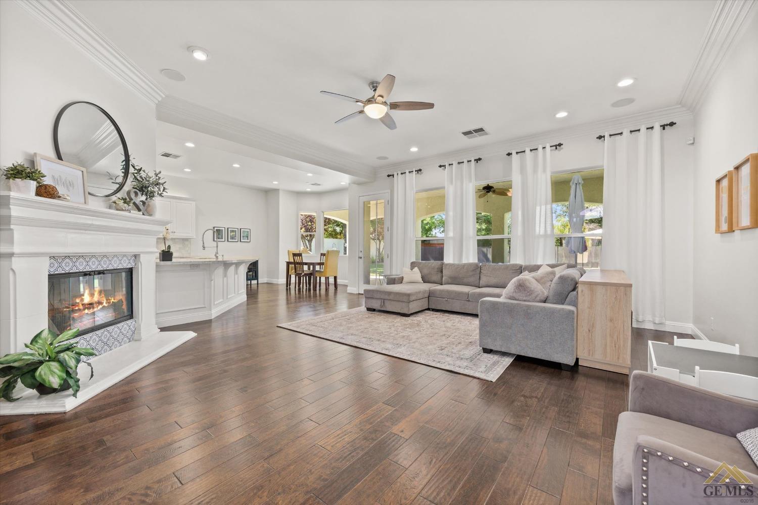 Undisclosed Address Bakersfield, CA 93311 - Photo 12 of 45 a living room with furniture and a fireplace