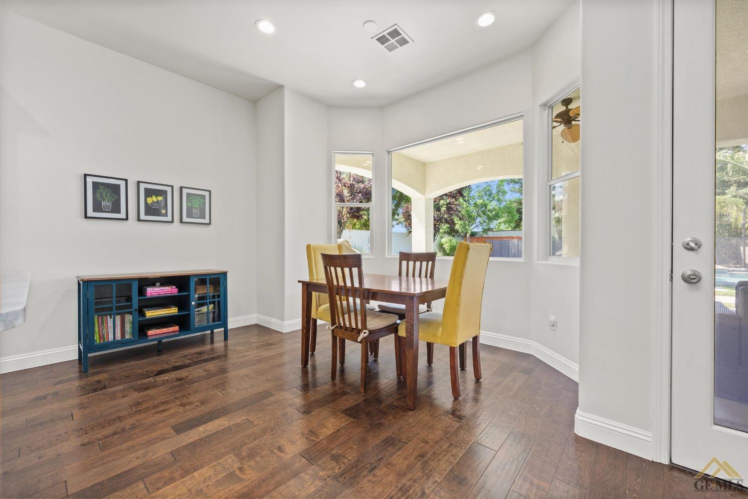 Undisclosed Address Bakersfield, CA 93311 - Photo 18 of 45 a dining room with furniture mountain view and a fireplace