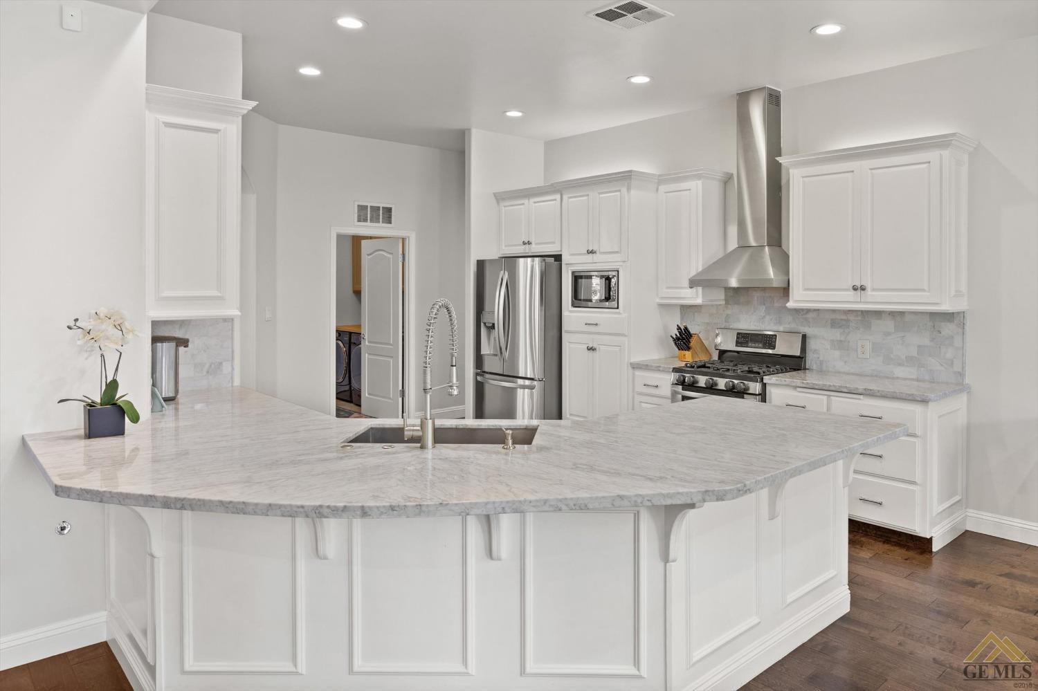 Undisclosed Address Bakersfield, CA 93311 - Photo 20 of 45 a kitchen with stainless steel appliances granite countertop a sink refrigerator and cabinets