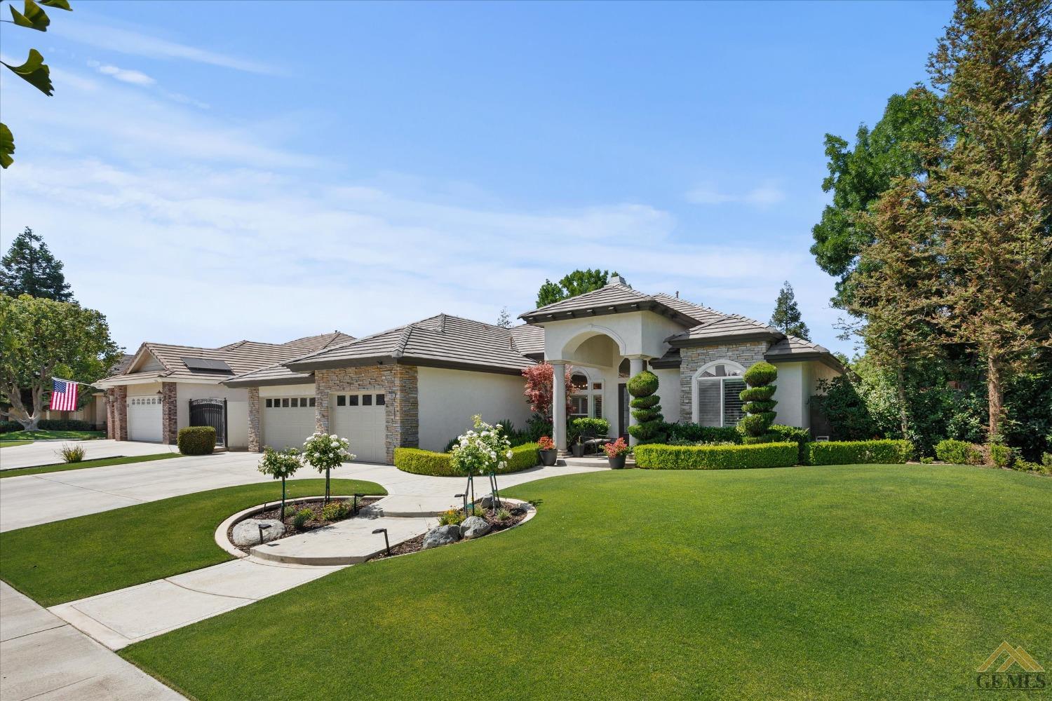 Undisclosed Address Bakersfield, CA 93311 - Photo 2 of 45 a front view of a house with yard and green space