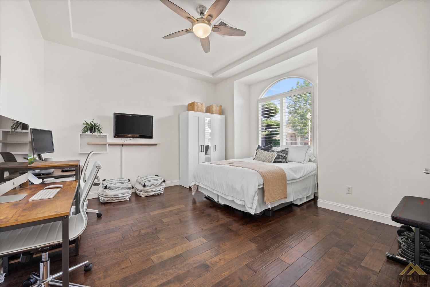 Undisclosed Address Bakersfield, CA 93311 - Photo 30 of 45 a bedroom with a bed and a flat screen tv