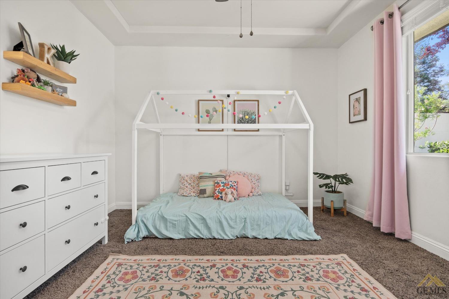 Undisclosed Address Bakersfield, CA 93311 - Photo 36 of 45 a bedroom with a bed and wooden floor