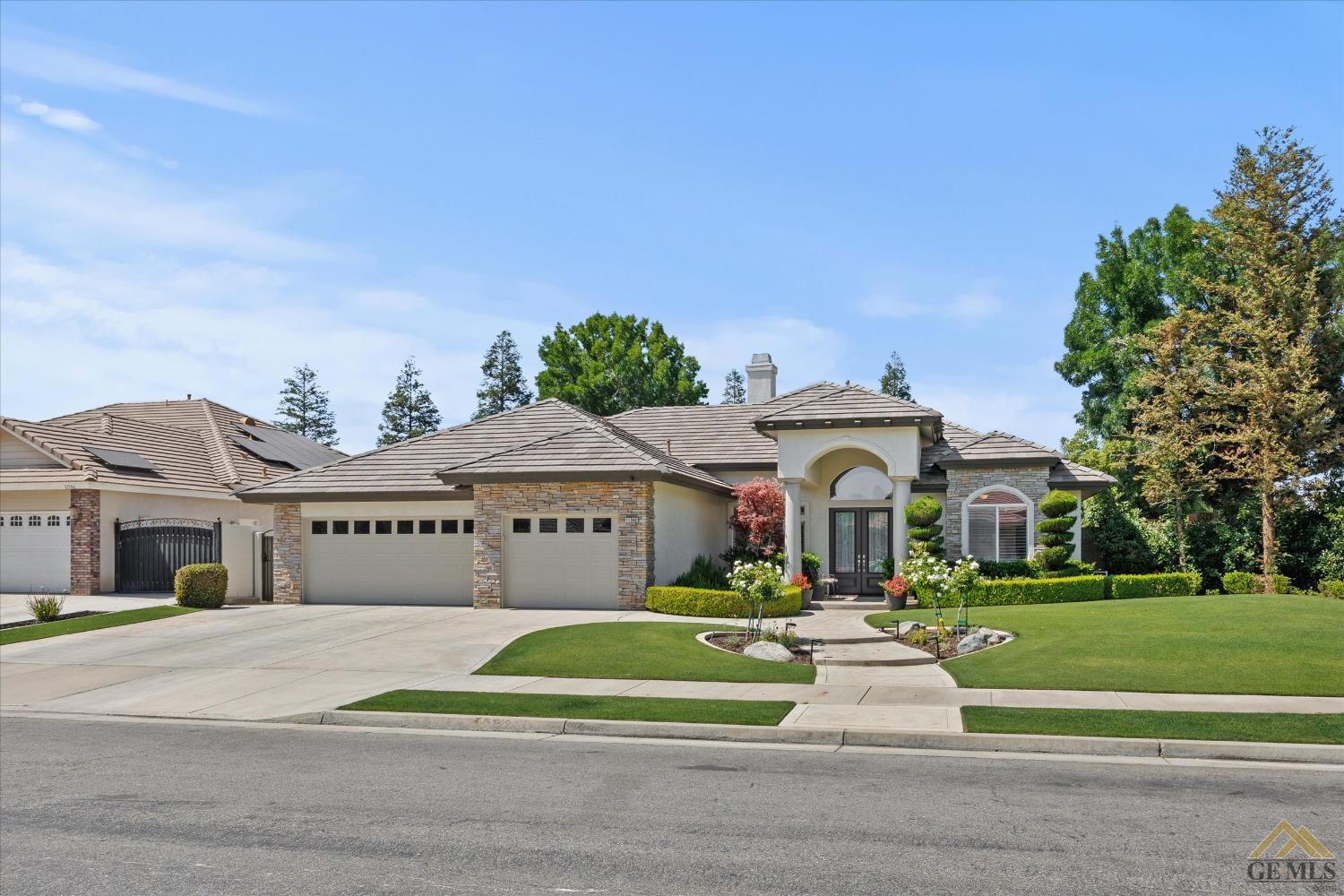 Undisclosed Address Bakersfield, CA 93311 - Photo 4 of 45 a front view of a house with a yard
