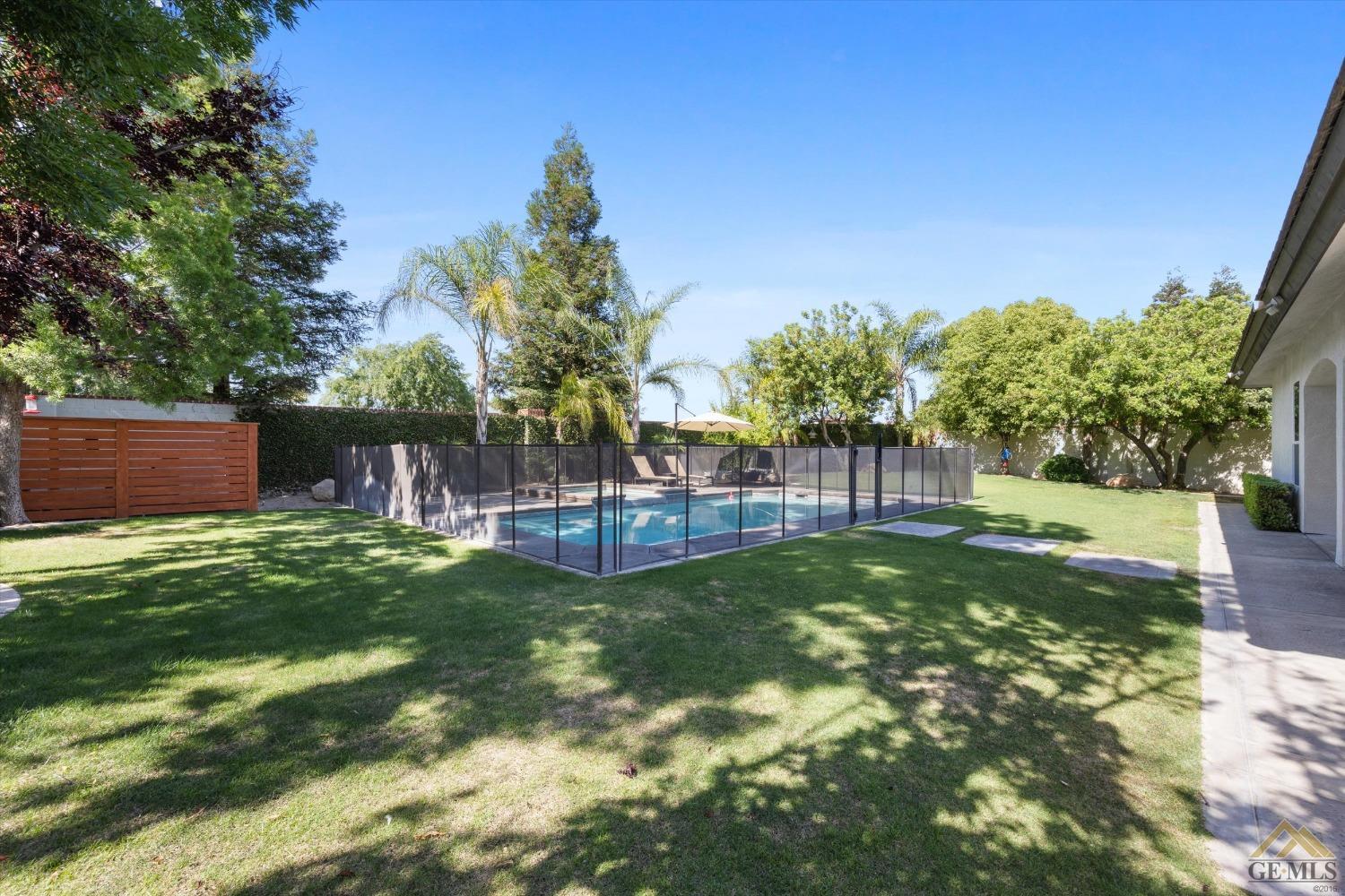 Undisclosed Address Bakersfield, CA 93311 - Photo 42 of 45 a view of a backyard with a garden