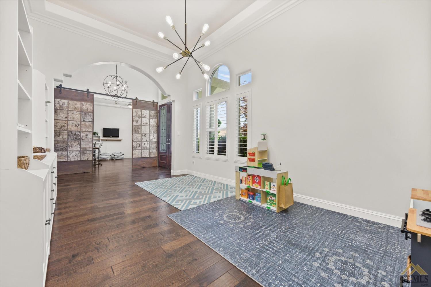 Undisclosed Address Bakersfield, CA 93311 - Photo 10 of 45 a living room with fireplace and furniture