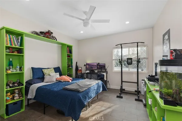 a bathroom with a double vanity sink a toilet and a mirror