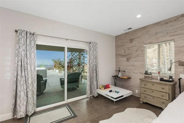 a spacious bathroom with double sink and a mirror