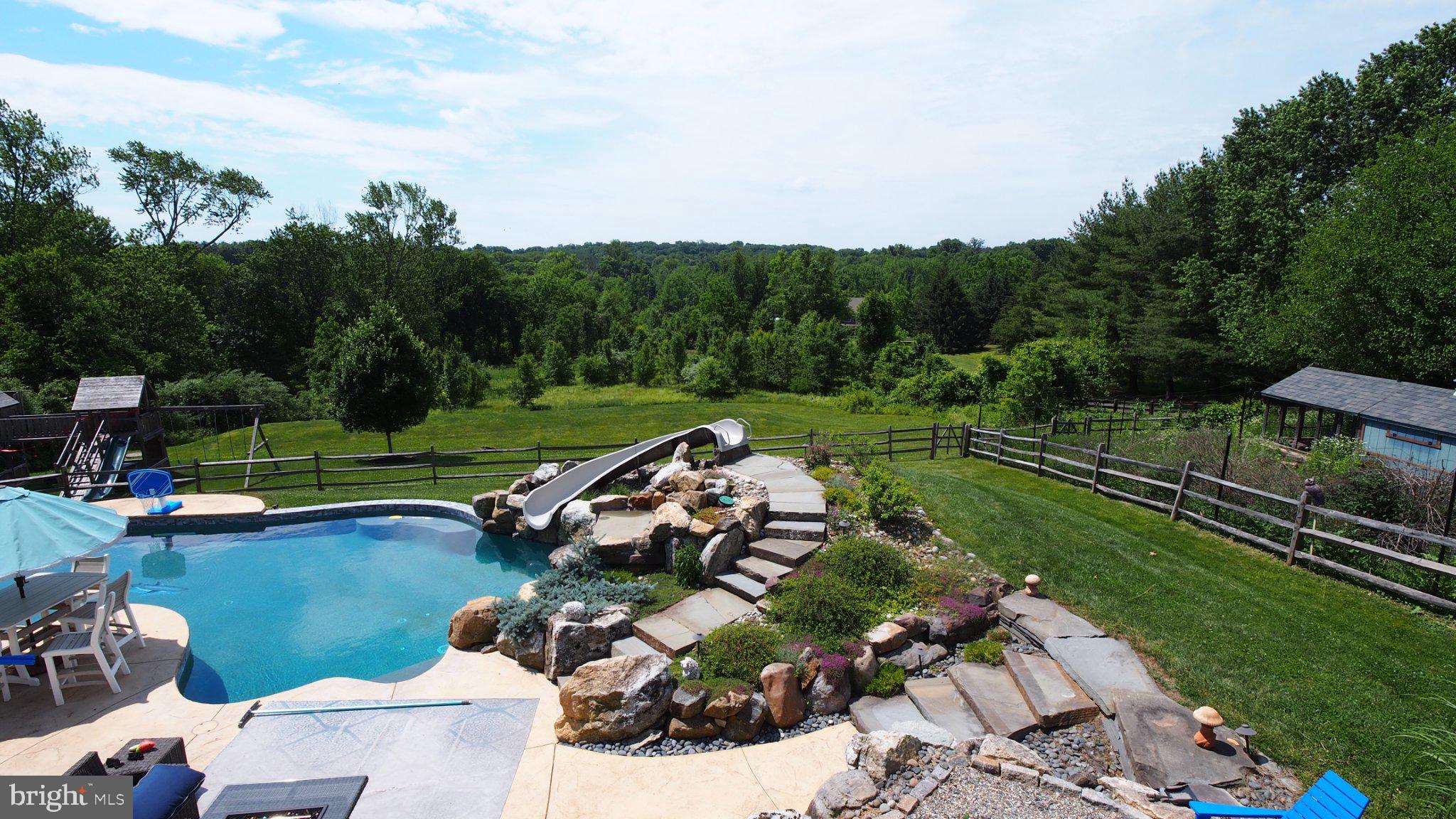 274 Pineville Road Newtown, PA 18940 - Photo 110 of 112 Serene backyard oasis with pool view.