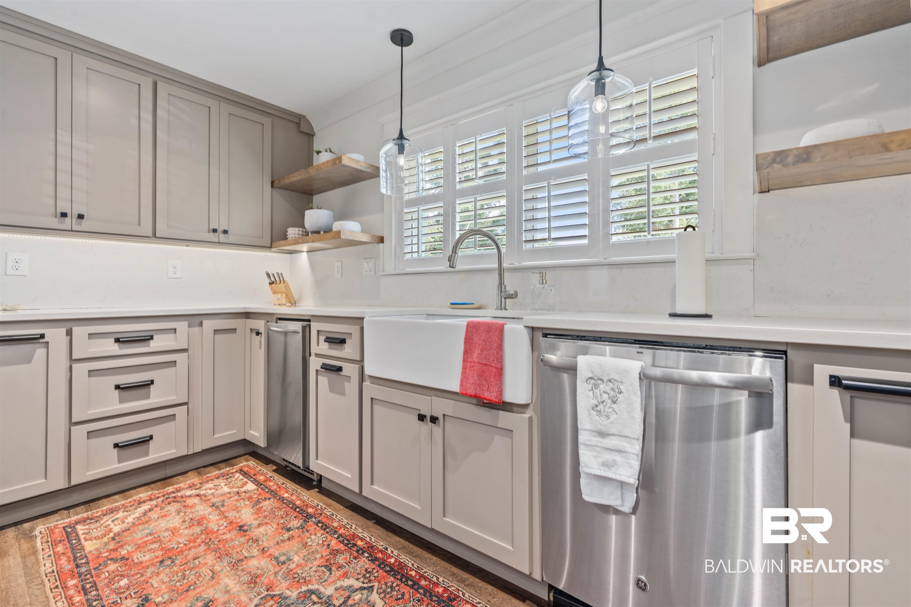 3808 Claridge Road North Mobile, AL 36608 - Photo 11 of 43 Kitchen with stainless steel dishwasher, pendant lighting, sink, light hardwood / wood-style floors, and gray cabinetry