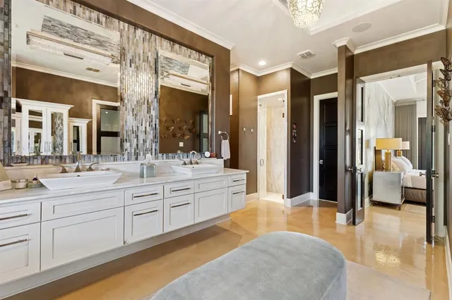 a spacious bathroom with a tub sink and mirror