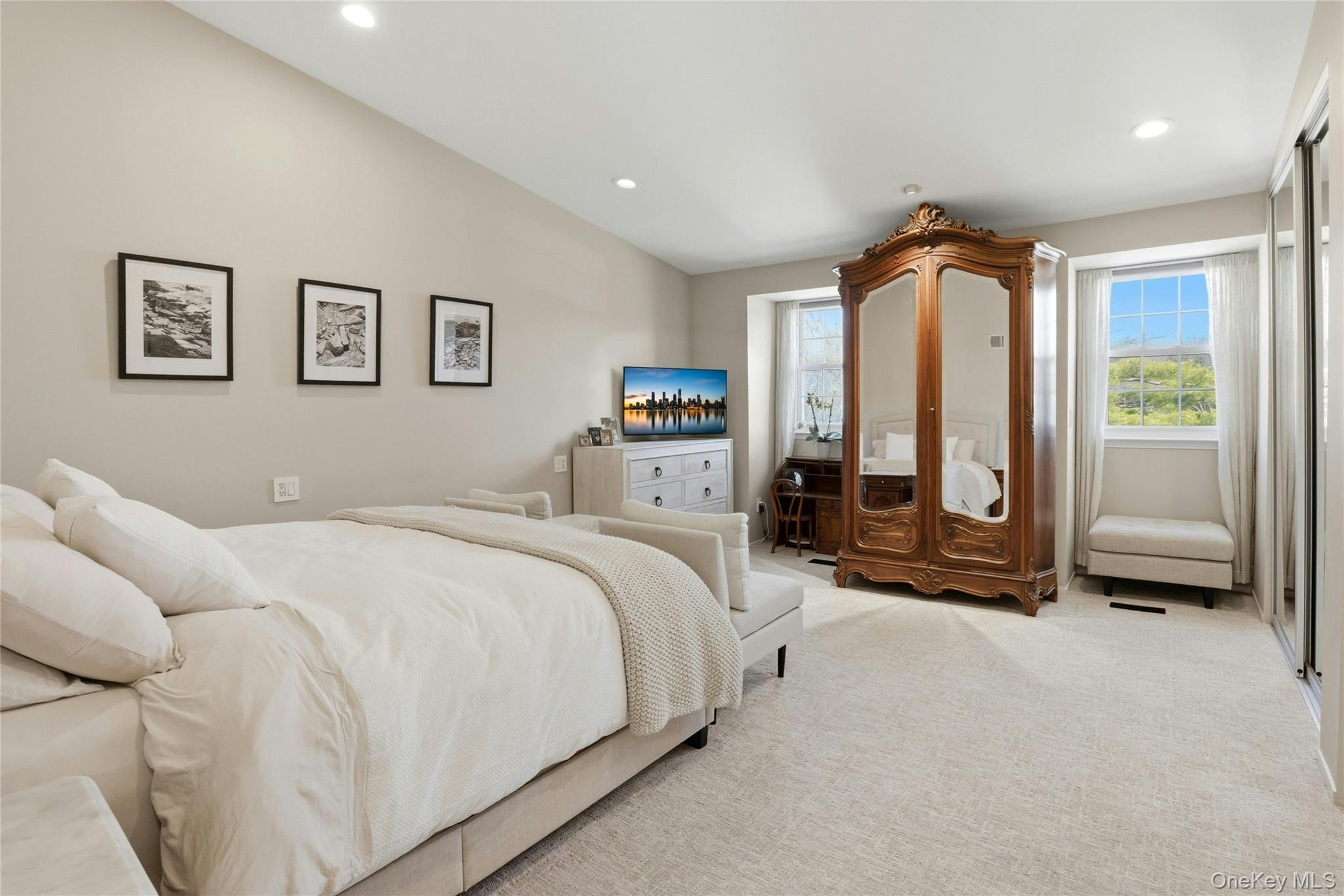 78 Hidden Ridge Drive Syosset, NY 11791 - Photo 10 of 21 a spacious bedroom with a bed and a large window
