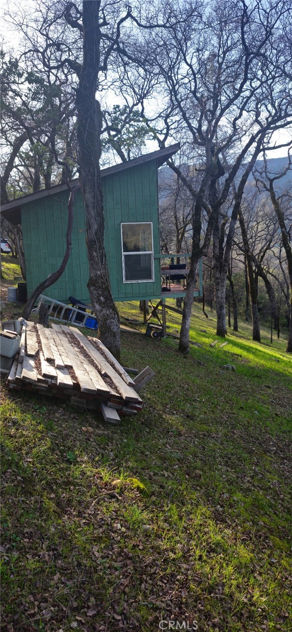 13566 Helltown Road Chico, CA 95928 - Photo 4 of 23 a backyard of a house with barbeque oven table and chairs