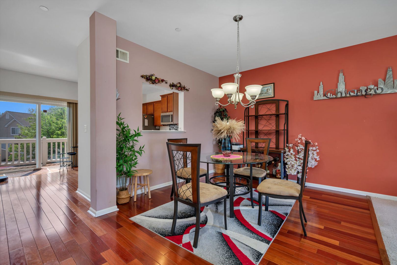 10323 Kerry Ridge Court, Unit 10323 Chicago Ridge, IL 60415 - Photo 3 of 16 a view of a dining room with furniture a chandelier and wooden floor