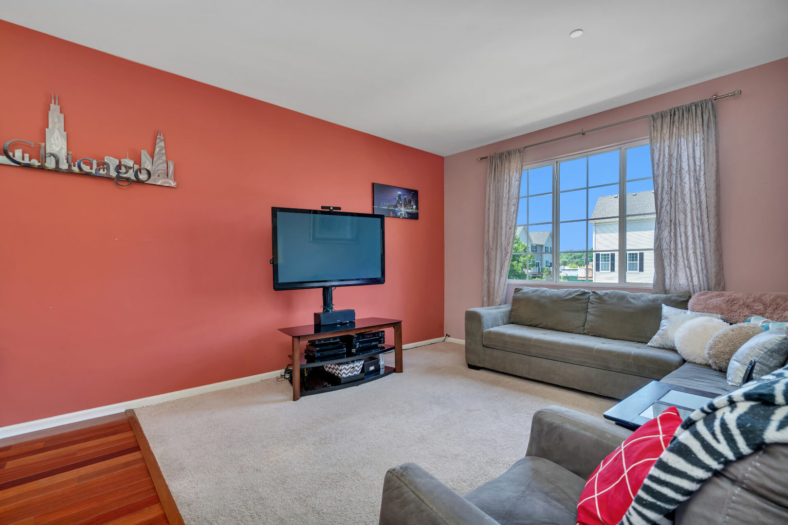 10323 Kerry Ridge Court, Unit 10323 Chicago Ridge, IL 60415 - Photo 5 of 16 a living room with furniture and a flat screen tv