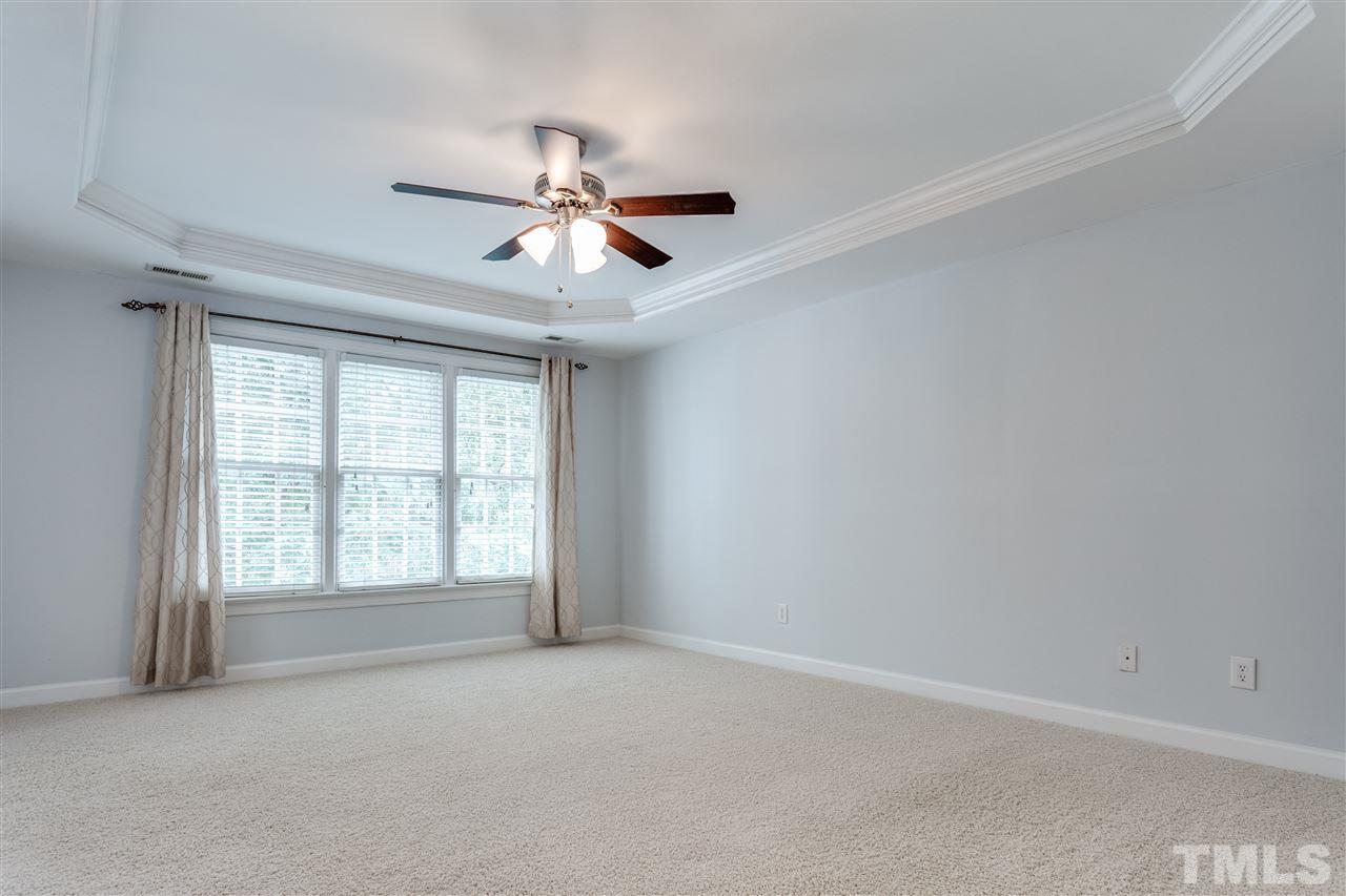 8401 Largo Springs Court Raleigh, NC 27613 - Photo 20 of 25 a view of an empty room with a window