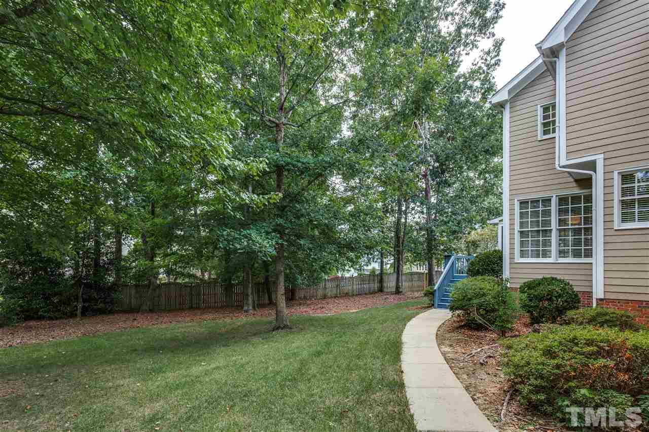 8401 Largo Springs Court Raleigh, NC 27613 - Photo 3 of 25 a view of a backyard with a garden