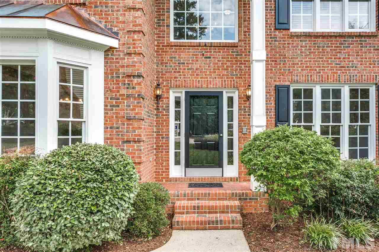 8401 Largo Springs Court Raleigh, NC 27613 - Photo 25 of 25 front view of a brick house with a large window