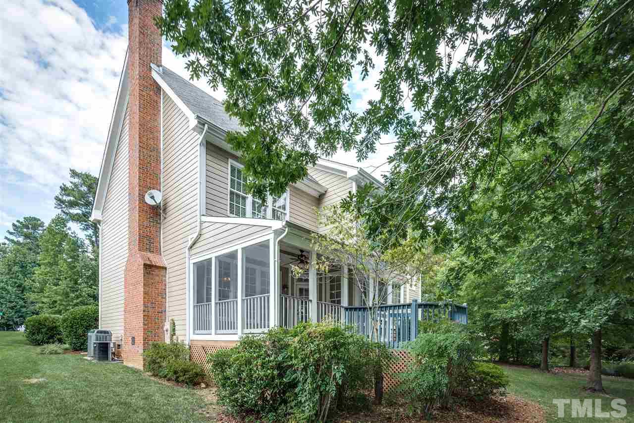 8401 Largo Springs Court Raleigh, NC 27613 - Photo 4 of 25 a view of a white house next to a yard