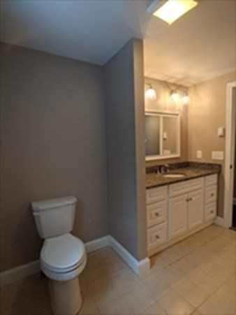77 Algerie Road Becket, MA 01223 - Photo 9 of 20 a bathroom with a toilet sink and mirror