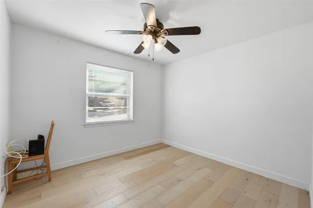 a view of a livingroom with a chandelier fan