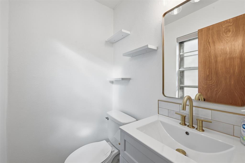 402 Vicki Street Keller, TX 76248 - Photo 13 of 21 a bathroom with a sink and a toilet