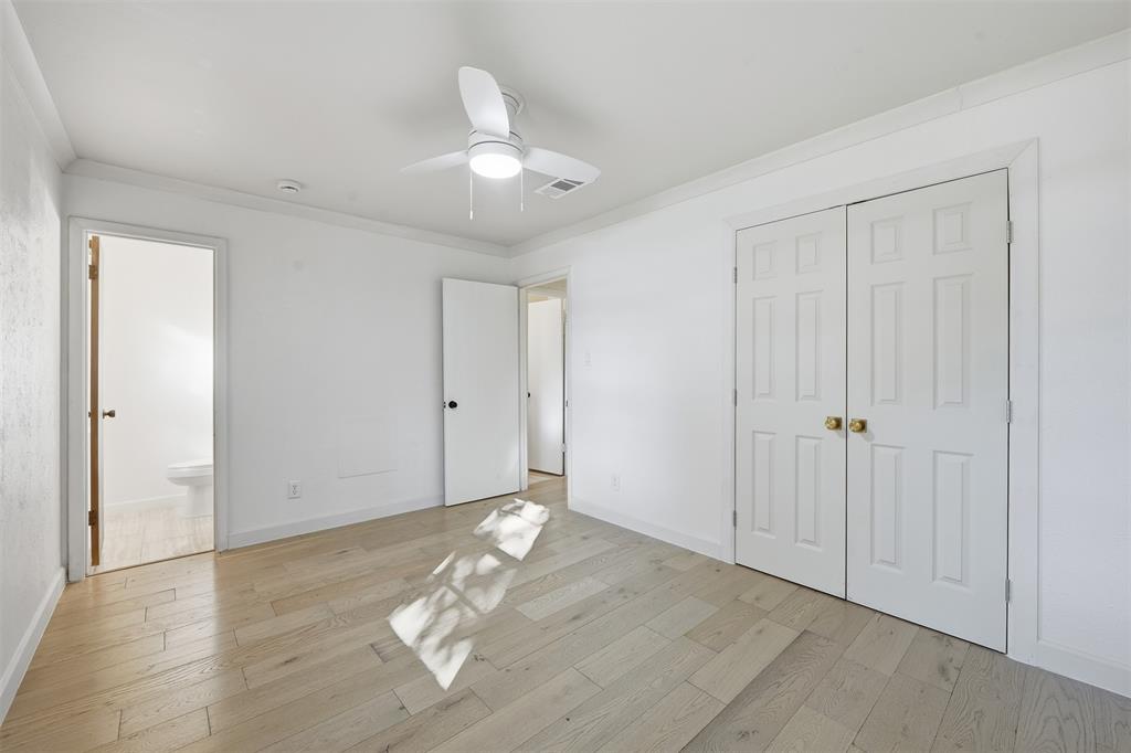 402 Vicki Street Keller, TX 76248 - Photo 9 of 21 wooden floor in an empty room with a window