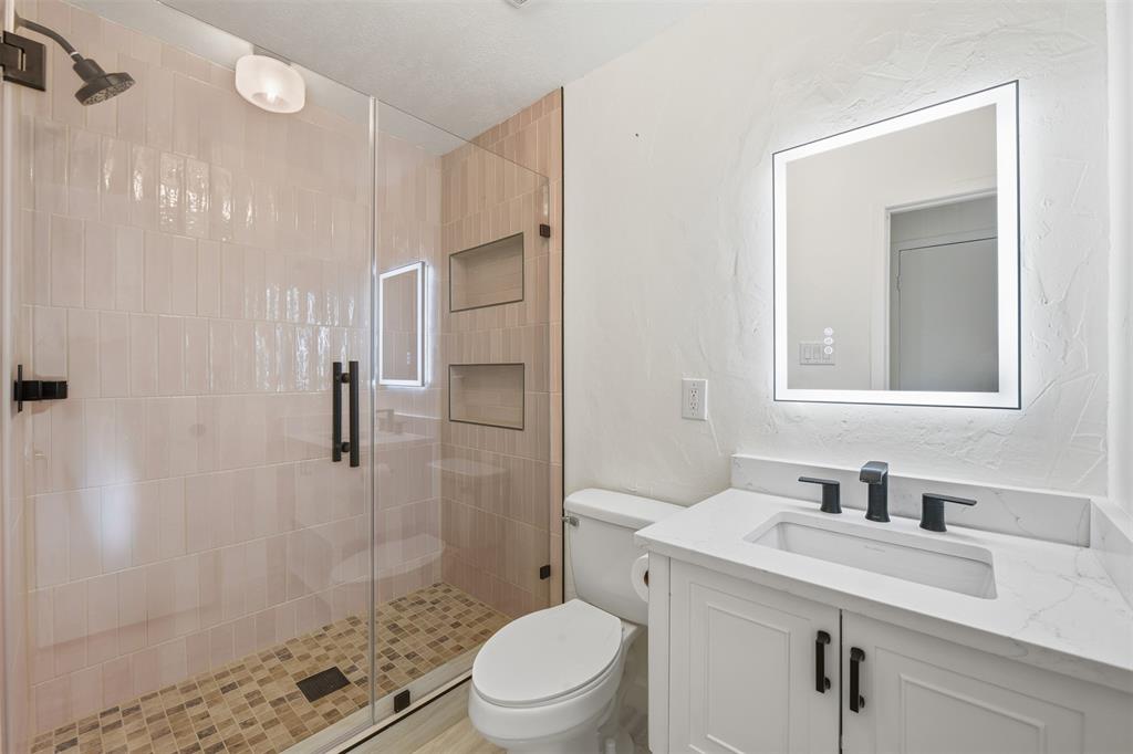 402 Vicki Street Keller, TX 76248 - Photo 10 of 21 a bathroom with a sink toilet and shower