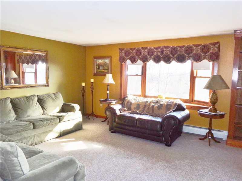 167 Elm Street Limerick, ME 04048 - Photo 6 of 23 Living Room. Sun drenched living room.